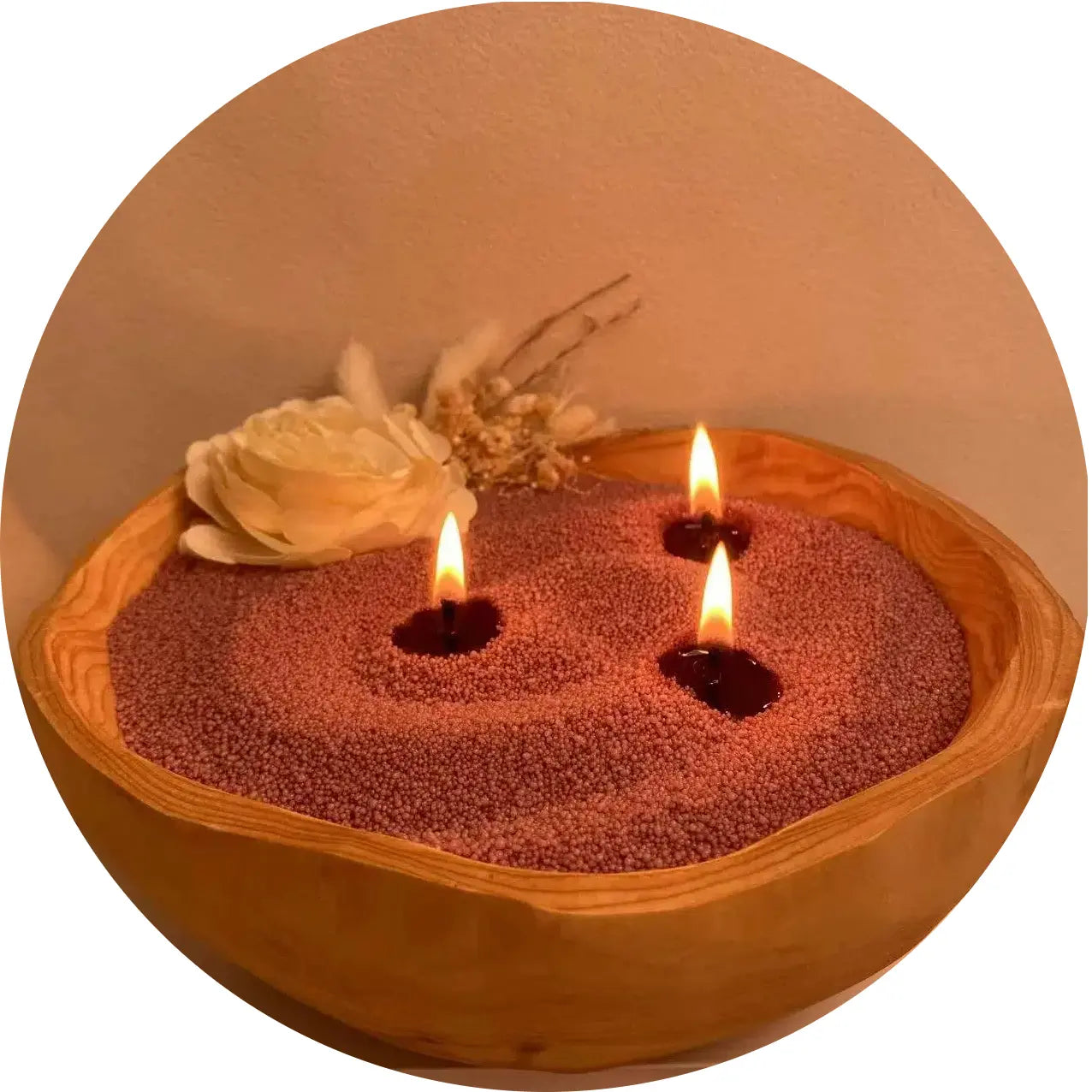 Pearled candle vessel collection image featuring a wooden candle bowl filled with blush rose pearled candle wax and soft flames.