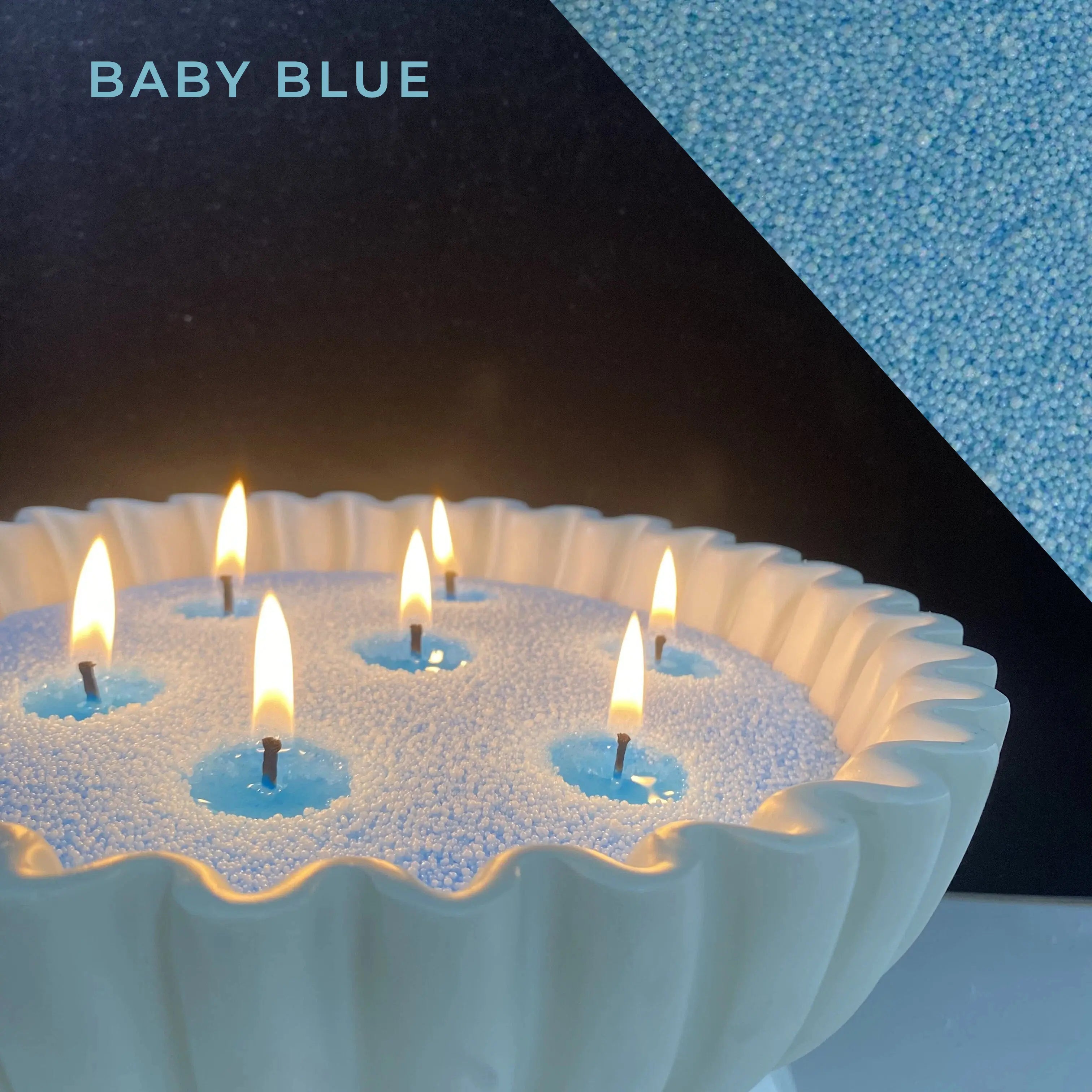 close-up of baby blue pearled candle wax with a clean flame and visible wax pearls