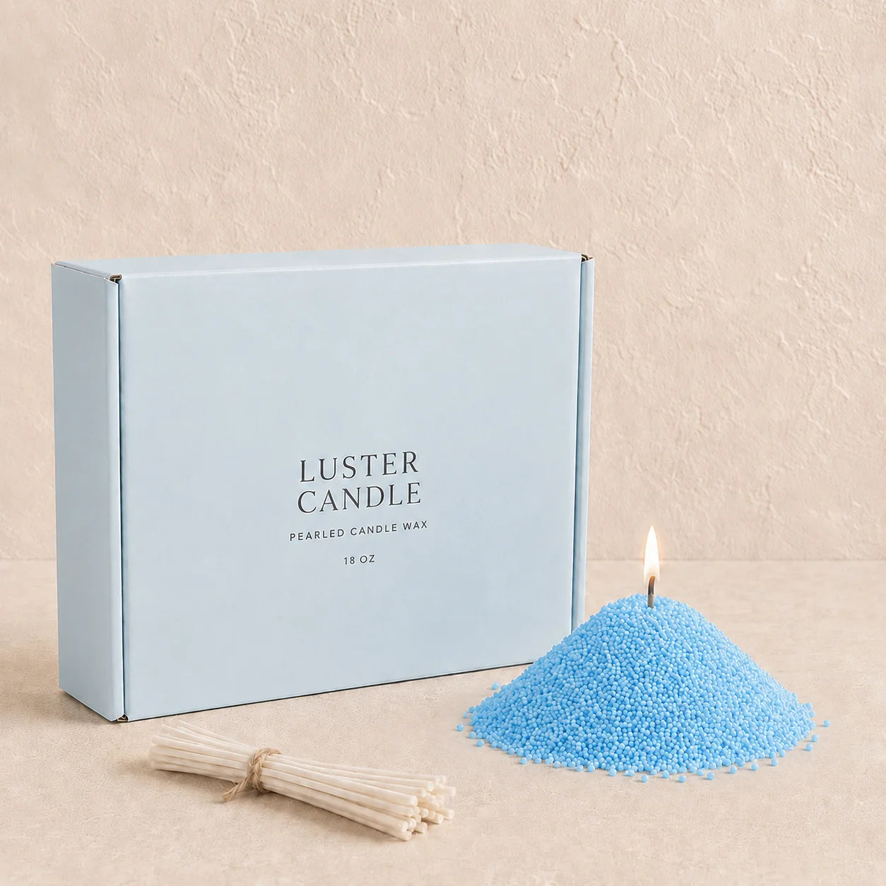 Baby Blue Pearled Candle Wax with milk blue Luster Candle box, pearled candle wax mound, cotton wick bundle, and soft flame.