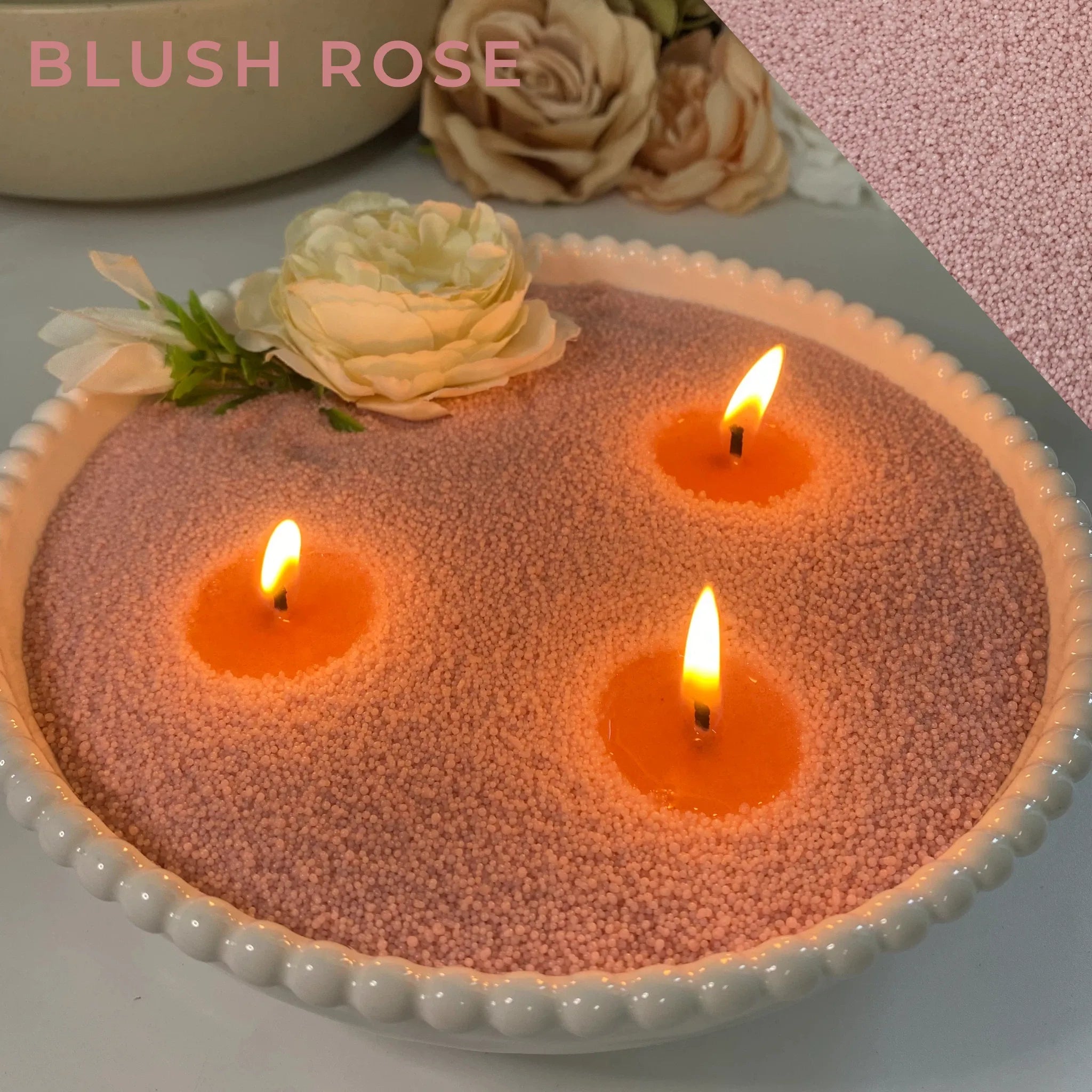 Close-up of Blush Rose scented pearled candle wax burning with visible wax beads, soft flames, and realistic melt pools