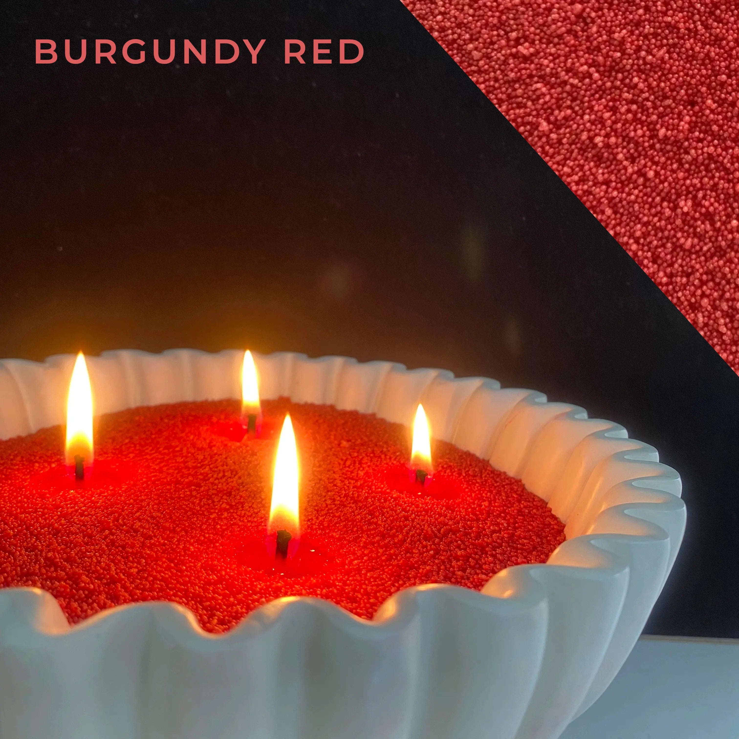 close-up of burgundy red pearled candle wax with a clean flame and visible wax pearls