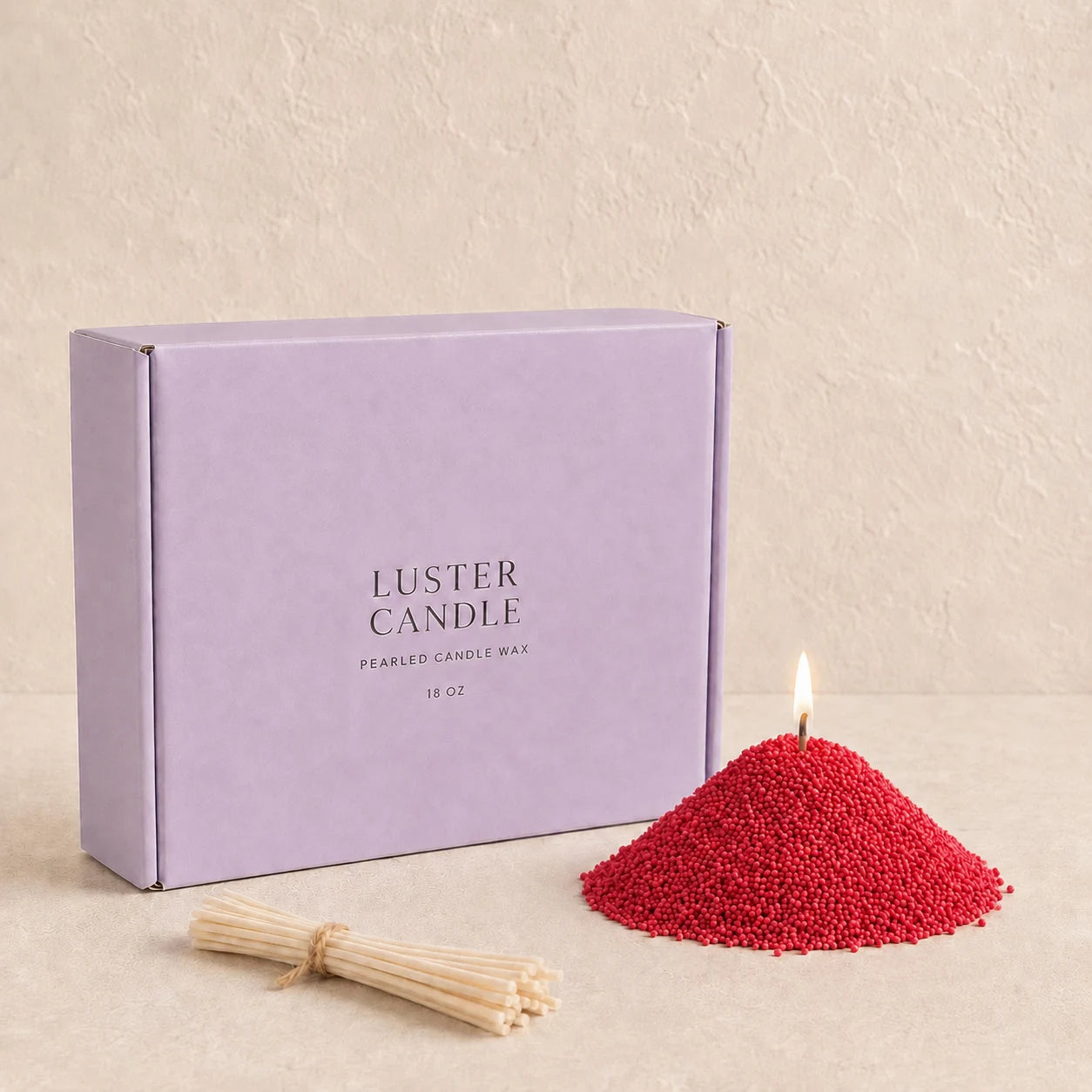 Burgundy Red Pearled Candle Wax with lavender purple Luster Candle box, pearled candle wax mound, cotton wick bundle, and soft flame.