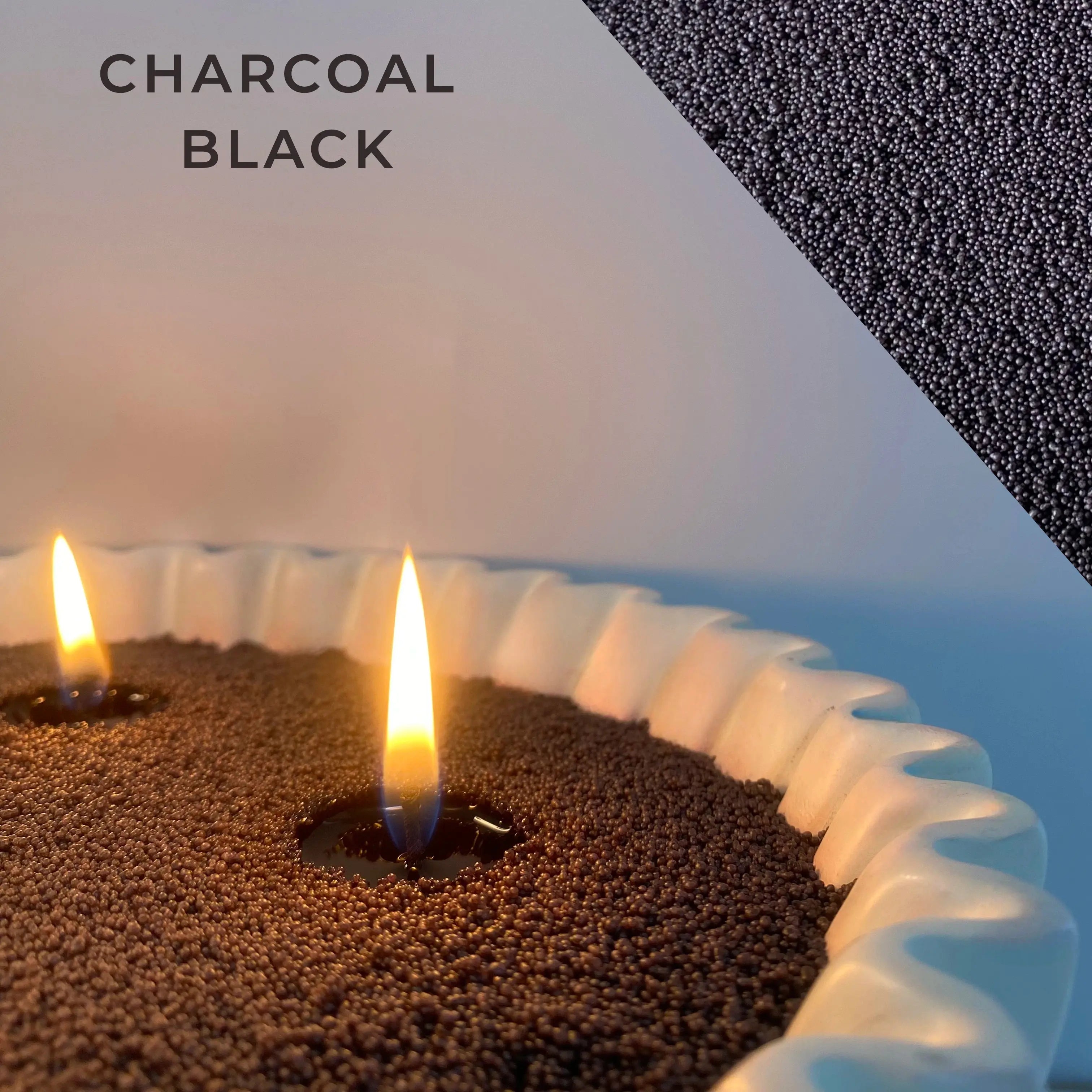 close-up of charcoal back pearled candle wax with a clean flame and visible wax pearls