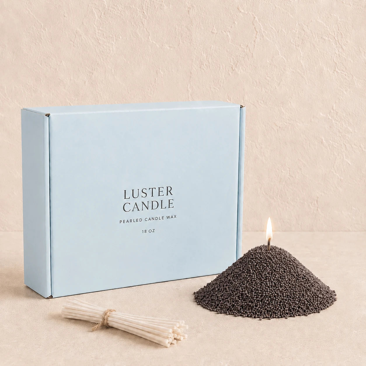 Charcoal Black Pearled Candle Wax with milk blue Luster Candle box, pearled candle wax mound, cotton wick bundle, and soft flame.