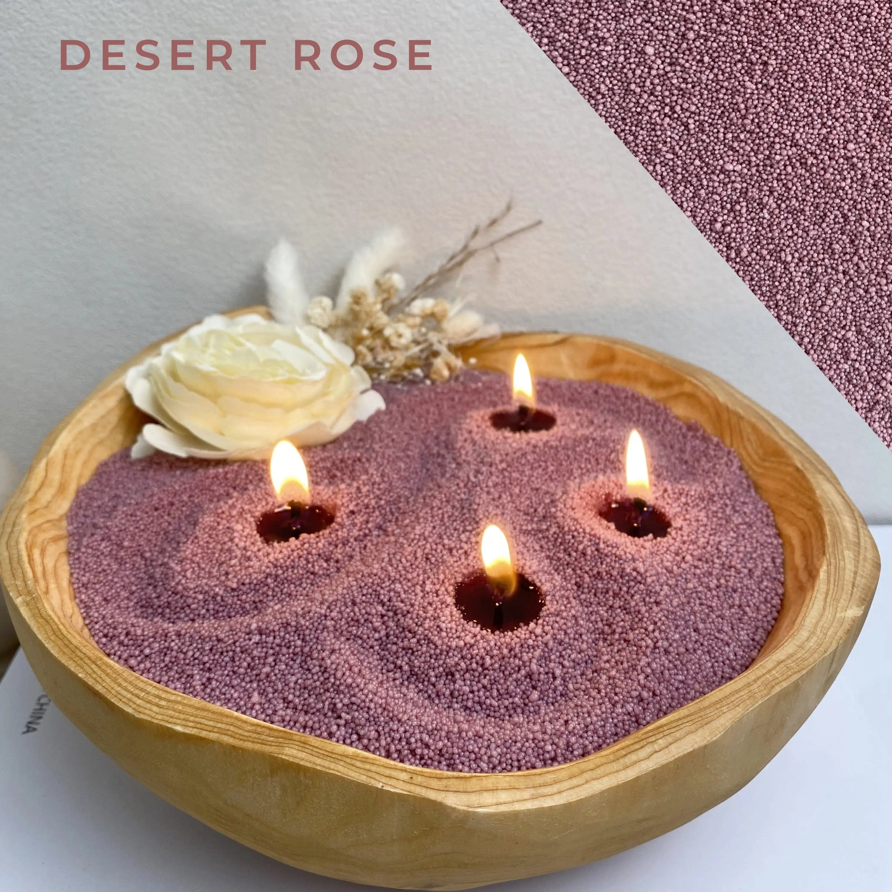 Close-up of Desert Rose pearled candle wax burning in a warm ivory ceramic bowl with five lit wicks.
