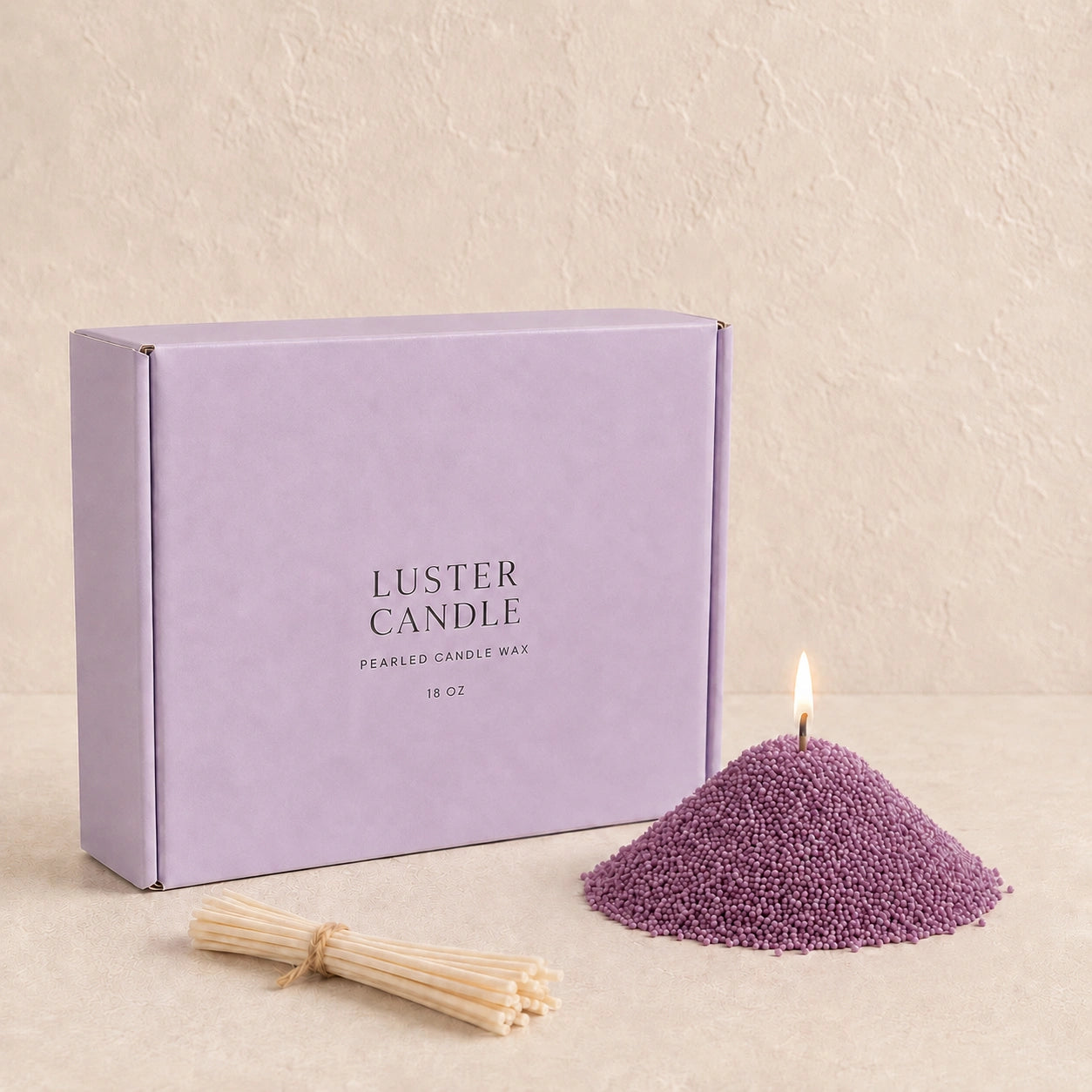 Desert Rose Pearled Candle Wax with lavender purple Luster Candle box, pearled candle wax mound, cotton wick bundle, and soft flame.