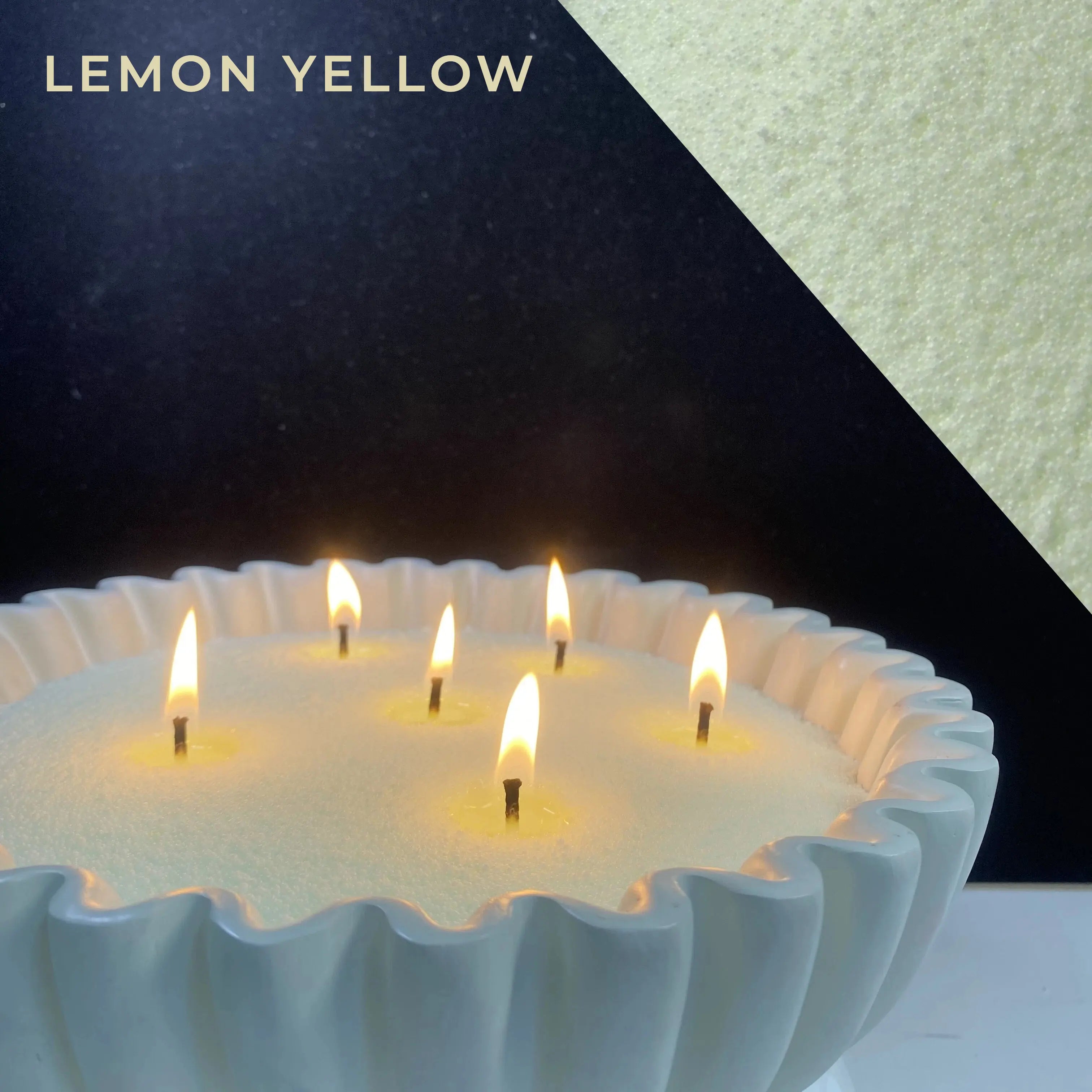 close-up of lemon yellow pearled candle wax with a clean flame and visible wax pearls
