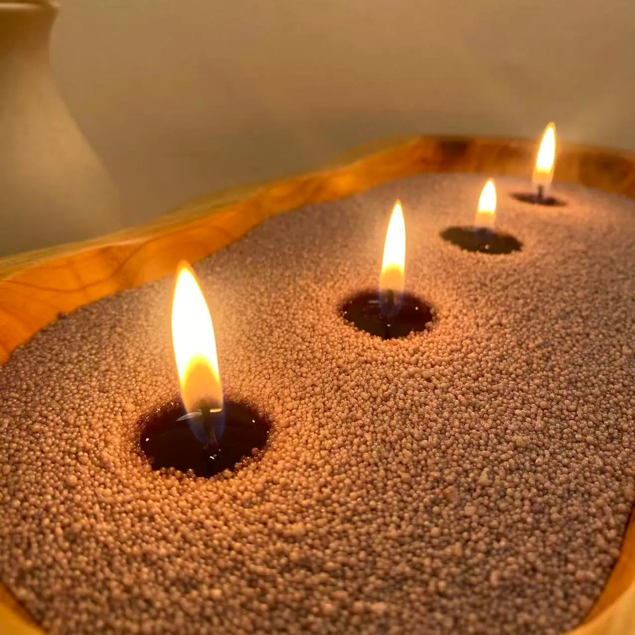 Mist Grey Pearled Candle Wax displayed in a minimalist home decor setting with soft candlelight, neutral styling, and a refillable candle vessel.