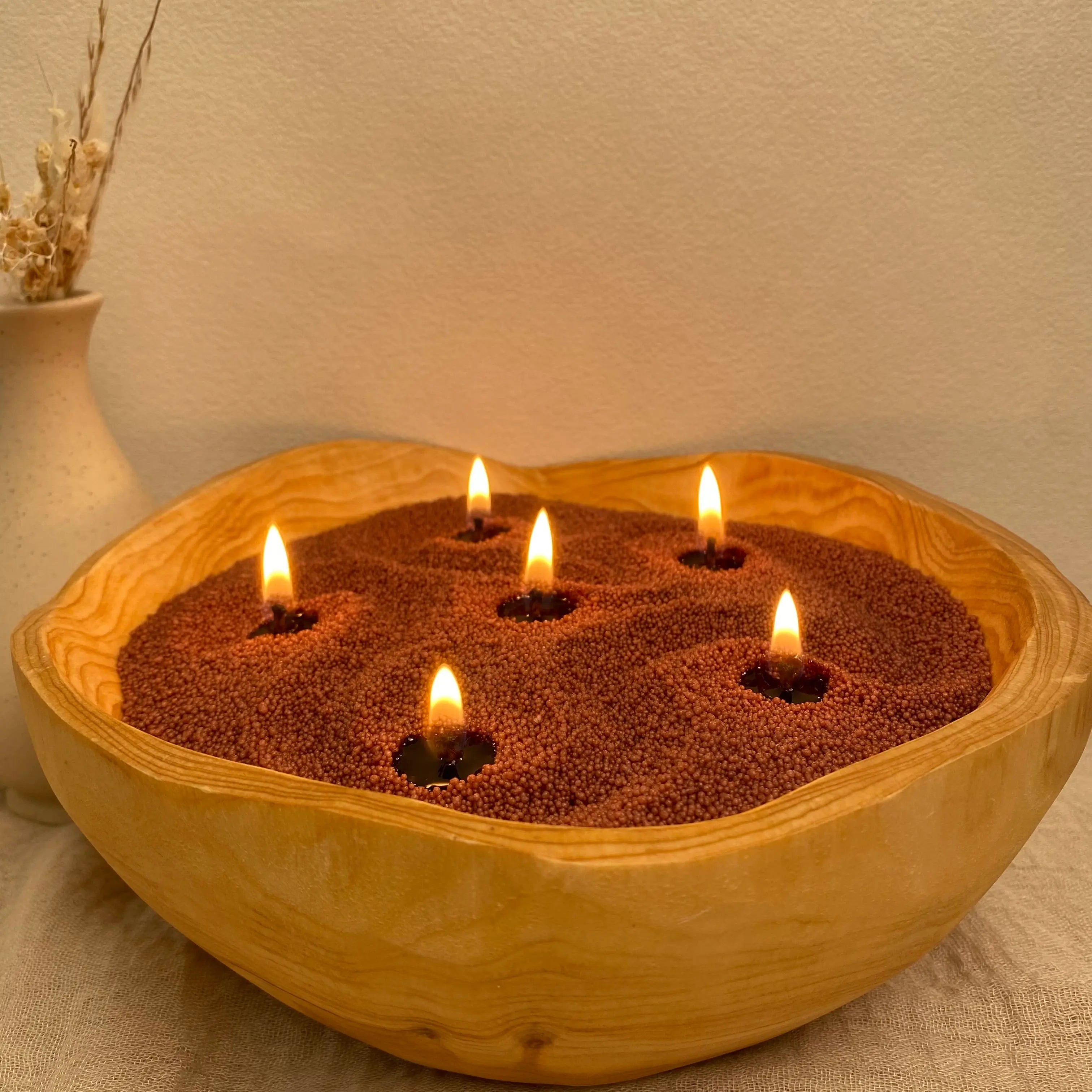 Mocha Brown Pearled Candle Wax burning in a wooden bowl with multiple cotton wicks in a warm home décor setting