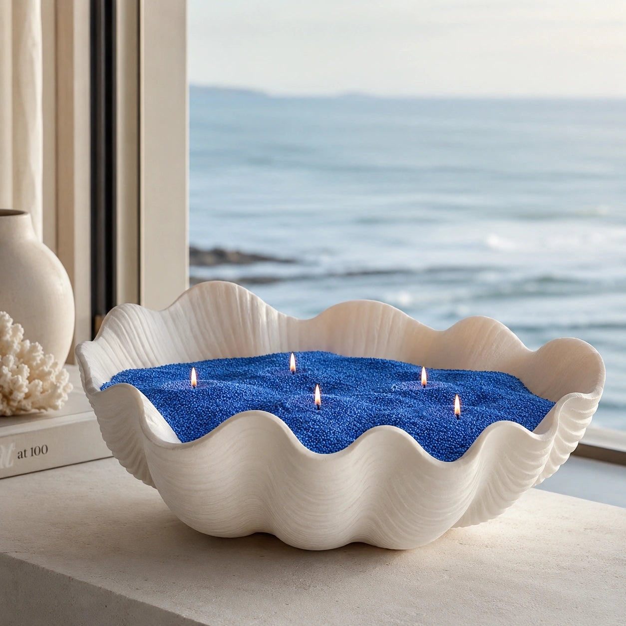  ocean blue pearled candle wax displayed in a warm home vessel scene