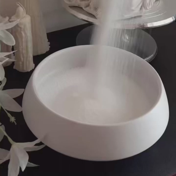 Soft White pearled candle wax in a minimal vessel with warm candlelight