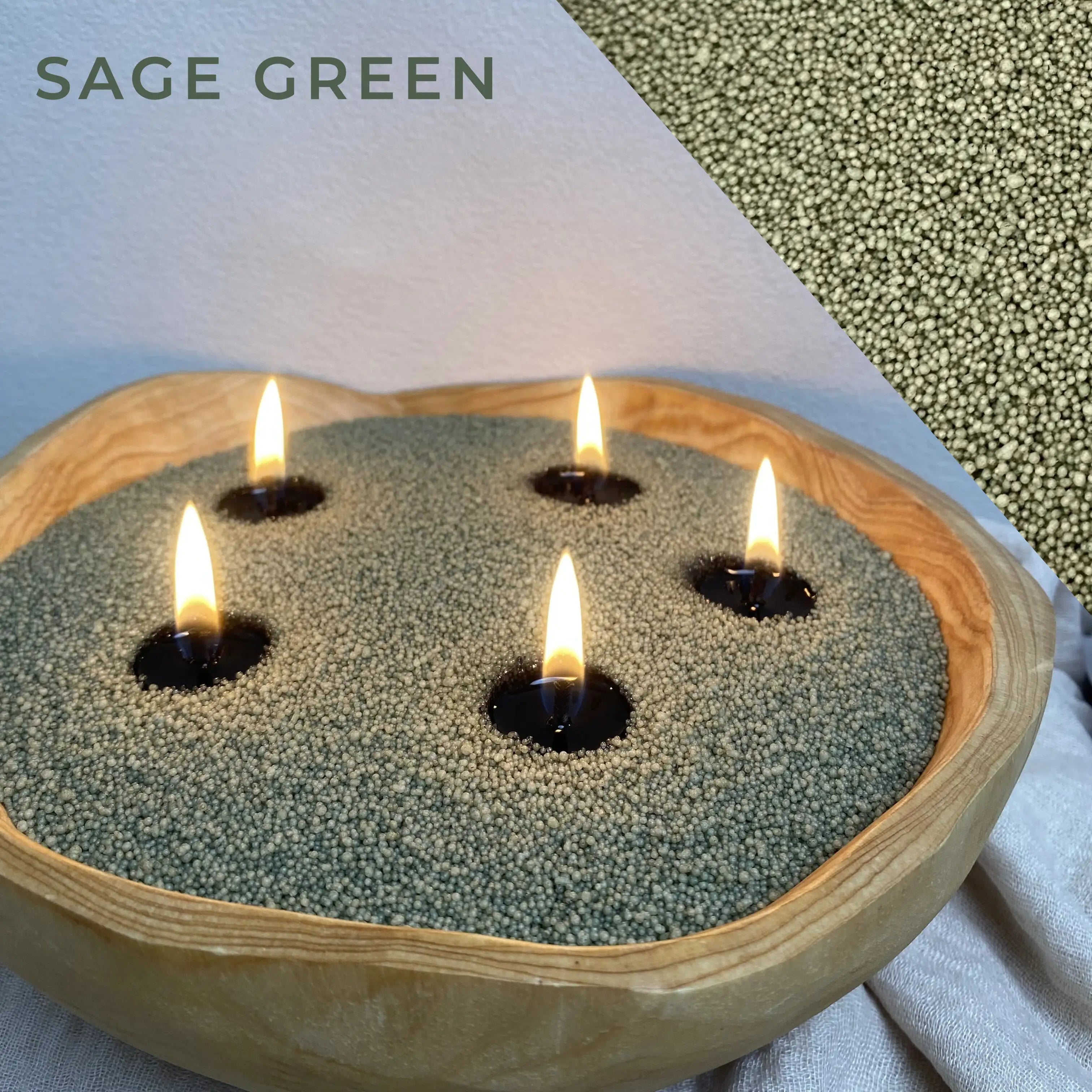 Close-up of Sage Green Pearled Candle Wax burning with visible green wax beads, soft flame glow, and refillable candle texture.