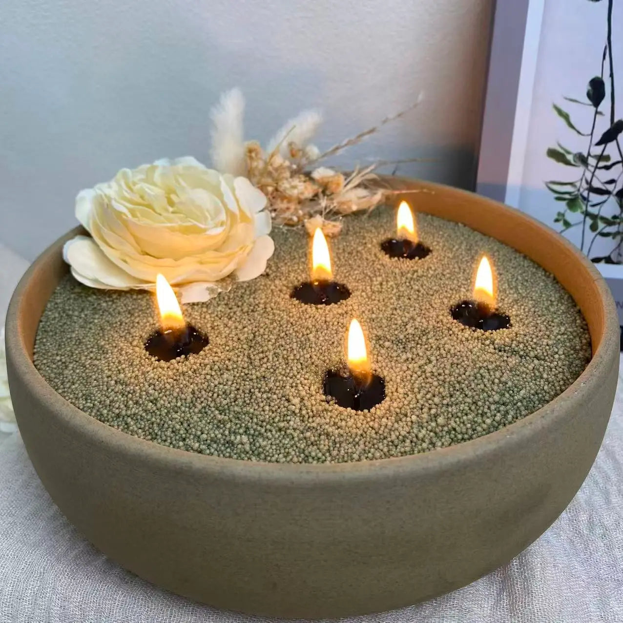 Sage Green Pearled Candle Wax displayed in a natural home decor setting with soft candlelight, botanical styling, and a heat-safe candle vessel.