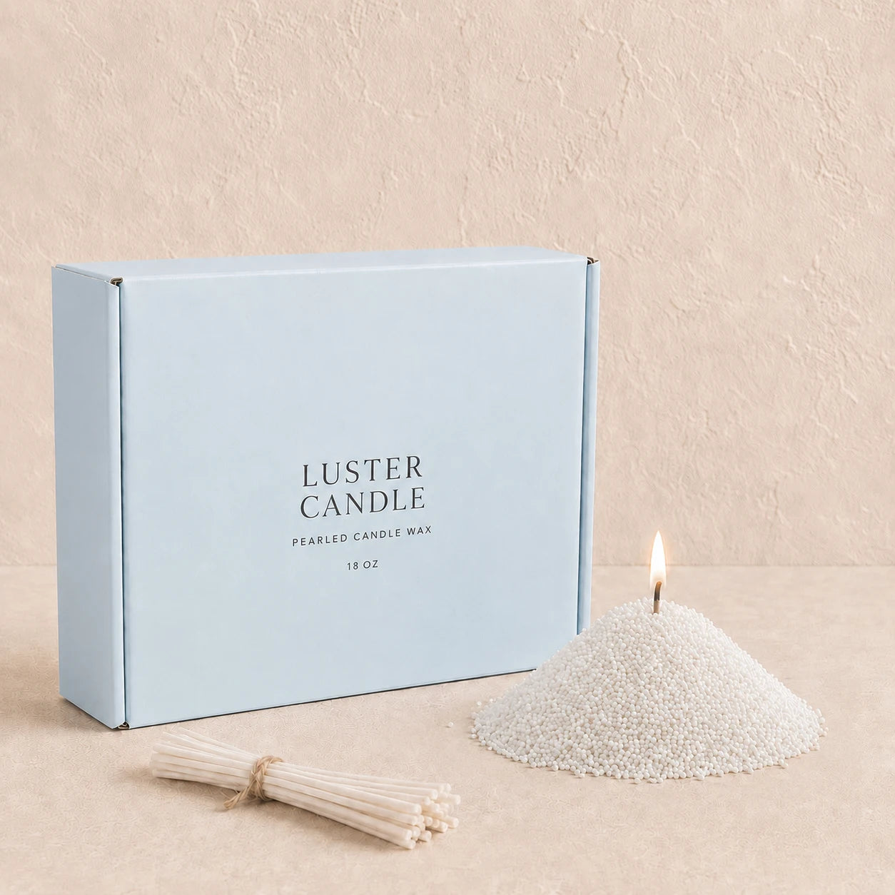 Soft White Pearled Candle Wax with milk blue Luster Candle box, pearled candle wax mound, cotton wick bundle, and soft flame.