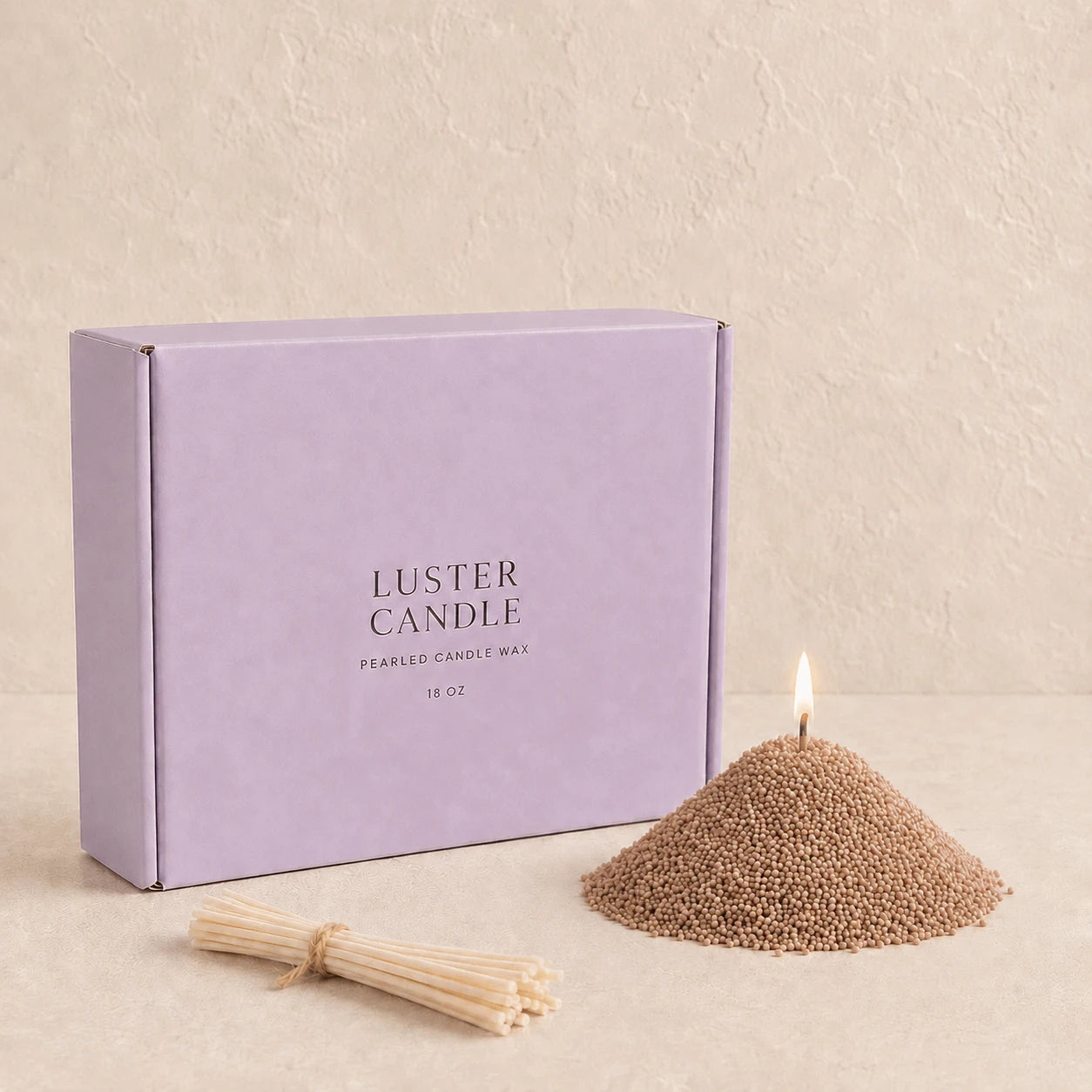 Warm Taupe Pearled Candle Wax with milk blue Luster Candle box, pearled candle wax mound, cotton wick bundle, and soft flame.